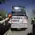 Protesters shoot water guns at a bus of tourists in Barcelona in April.