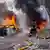 A fireman puts out fires in damaged vehicles