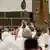 Muslim worshippers hold up mobile phones as pilgrims gather for prayers around the Kaaba, Islam's holiest shrine, at the Grand Mosque complex in the holy city of Mecca on June 2, 2025 ahead of the annual Hajj pilgrimage.
