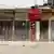 A row of shuttered shops at a market in Onitsha during a 'sit-at-home' protest (February 27, 2023)