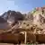 Saint Catherine's Monastery sits enclosed between large stone walls at the base of the Mount Sinai.