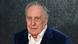 Frederick Forsyth wearing a white shirt and dark blue jacket looks at the camera Frederick Forsyth wearing a white shirt and dark blue jacket looks at the camera