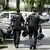 Policemen are seen in a street close to a school where, according to reports, several people died in a shooting, on June 10, 2025 in Graz, southeastern Austria