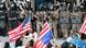 National Guard soldiers and federal Police officers stand guard as a group of protestors wave US flags at the Federal Building in Los Angeles National Guard soldiers and federal Police officers stand guard as a group of protestors wave US flags at the Federal Building in Los Angeles
