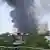 This frame grab from a video by @ashlovetea on June 12, 2025 made available on the Eurovision Social Newswire (ESN) platform via AFPTV shows a plume of smoke rising after Air India flight 171 crashed near the airport in Ahmedabad