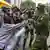 A protester scuffles with the police during a protest over the death in police custody of blogger Albert Ojwang
