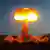 An illustration of the explosion of an atomic bomb with a mushroom cloud in the desert.
