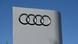 The four interlocking rings of the Audi logo as seen on a large outdoor sign The four interlocking rings of the Audi logo as seen on a large outdoor sign