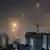 This picture shows rocket trails in the sky above Netanya on June 13, 2025
