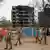 Security personnel can be seen at the crash site of Air India Boeing 787-8 Dreamliner plane in Ahmedabad, India.