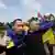 Ukrainian prisoners of war (POWs) react after a swap at an unknown location in Ukraine