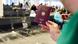 A hand holding up a German passport at an airport A hand holding up a German passport at an airport