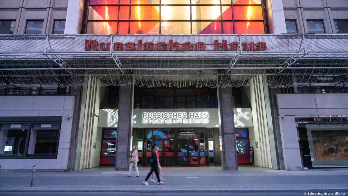 Facade of the Russian House, as people walk by, in 2023