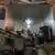 Benches and hoardings are seen strewn on the floor following the bomb blast