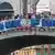 Protesters display a banner reading "No Space for Bezos!" on the Rialto Bridge during a protest against Amazon founder Jeff Bezos' upcoming wedding to Lauren Sanchez being held in Venice, Italy, June 13, 2025