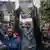 Demonstrators chant and hold up placards with faces of the victims of last year's protest in Nairobi