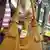 A simulated theft of a bottle of liquor