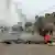 Des nuages de fumée dans une rue après des manifestations contre Faure Gnassingbé