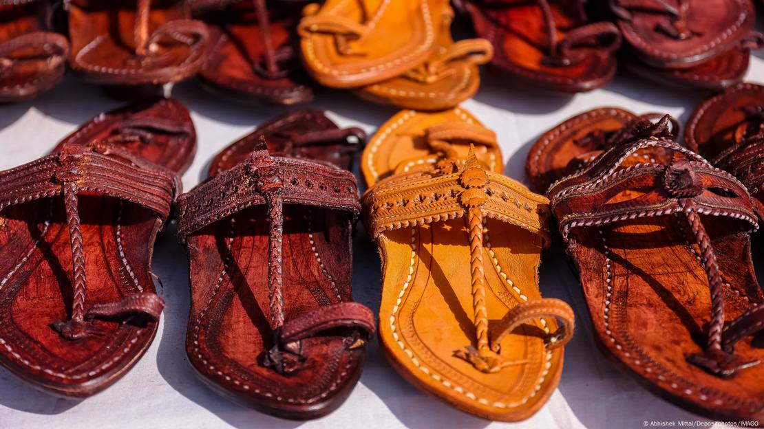 Pictures of Kohlapuri sandals lined up in a row.