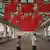 Two joggers pass beneath a canopy of Hong Kong and China flags