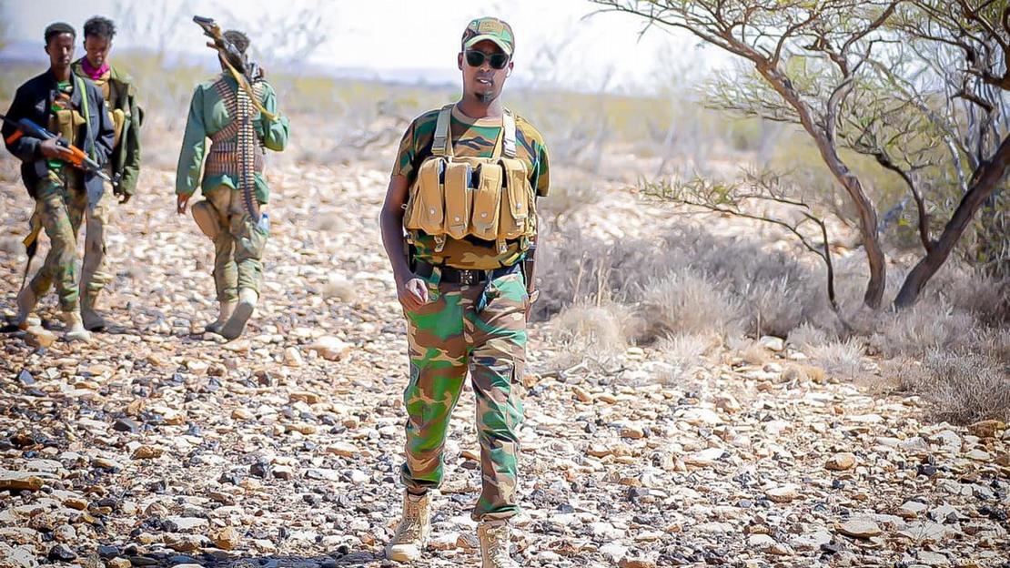 Ayub Abdirizak with armed fighters in Somalia