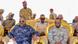 Ayub Abdirizak one row behind Puntland President Deni, who sits in a golden chair