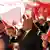 Tunc Soyer and his wife Neptun soyer in a frame with Turkish flags on Izmir's Day of Liberty