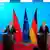 German Foreign Minister Johann Wadephul, right, and Chinese Foreign Minister Wang Yi brief the media at the foreign ministry in Berlin, Germany