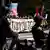 Independence Day anti-Trump protest in Washington, DC The lead banner of a protest against U.S. President Donald Trump and his administration is seen while the event s police escort waits for the march to begin