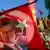Ekrem Imamoglu's face seen on a Turkish flag waved by a supporter