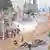 Smoke rises from a dirt road in Nairobi