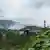 A factory emitting smoke in Byrnihat, Meghalaya, India on July 5, 2025.
