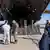 A photo released by the Department of Homeland Security shows men being led into a plane as they are being deported
