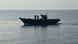 A wooden boat carrying North Korean individuals move northward in the East Sea A wooden boat carrying North Korean individuals move northward in the East Sea