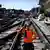 A construction worker drinks water in France during heatwave