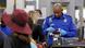 A uniformed TSA agent inspects a passport as a line of passengers is seen lined up in front of him at Miami International Airport in Florida in a file photo from 2016 A uniformed TSA agent inspects a passport as a line of passengers is seen lined up in front of him at Miami International Airport in Florida in a file photo from 2016