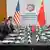 US Secretary of State Marco Rubio meets with China's Foreign Minister Wang Yi in Kuala Lumpur, with aides sitting on both sides of a long conference table, on July 11, 2025