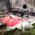 A firefighter stands next to the crashed Air India Boeing 787-8 Dreamliner aircraft, in Ahmedabad, India on June 13, 2025