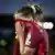 Carlotta Wamser covers her face with her shirt after being sent off for Germany at Euro 2025