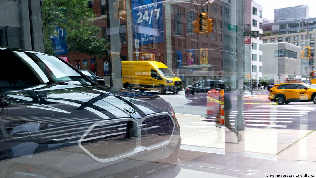 A BMW car seen in a reflection in New York