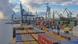 The container port of Gdynia in Poland with stacked containers and multiple cranes The container port of Gdynia in Poland with stacked containers and multiple cranes