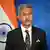 Indian Foreign Minister Subrahmanyam Jaishankar in front of Indian flag at Brussels summit in June 2025