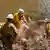 Rescue crews work to dismantle debris along river