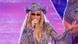 Beyonce makes a hand gesture as she performs in a glittery costume and a hat during the UK leg of the Cowboy Carter tour on June 5, 2025 Beyonce makes a hand gesture as she performs in a glittery costume and a hat during the UK leg of the Cowboy Carter tour on June 5, 2025