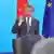 China's Foreign Minister Wang Yi speaks at a podium in front of the Chinese and EU flags at the foreign affairs office in Berlin, Germany