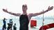 Florian Wellbrock jubelt mit ausgebreiteten Armen über Gold im 10-km-Freiwasserschwimmen Florian Wellbrock jubelt mit ausgebreiteten Armen über Gold im 10-km-Freiwasserschwimmen