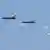 Myanmar military jets drop bombs equipped with parachutes during a military exercise in 2018