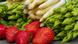 Green and white asparagus and strawberries on a wooden table Green and white asparagus and strawberries on a wooden table