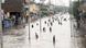 Pakistani people wade through a flooded street in the city of Rawalpindi on July 17, 2025. Pakistani people wade through a flooded street in the city of Rawalpindi on July 17, 2025.