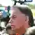Jair Bolsonaro e, atrás dele, câmeras de jornalistas